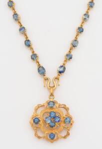 A gold and sapphire pendant necklace. 22ct yellow gold. Weight 29.97 grams. Length 50cm. Length of pendant 3.5cm.