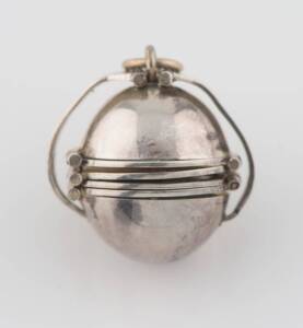 A Mexican puzzle ball pendant. Silver. Diameter 2cm.