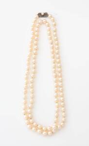 An Akoya pearl necklace, Mikimoto. 6.5 - 7mm. Length 84cm. Signed silver clasp.