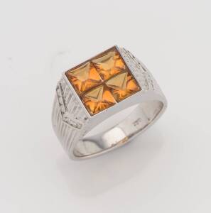 A citrine and diamond signet ring. 18ct white gold. Weight 7.81 grams. Size Q ½. 