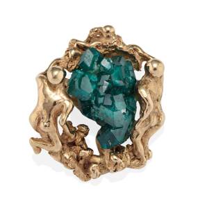 A figurative, synthetic emerald crystal brooch pendant, circa 1970's. 9ct yellow gold. Weight 29 grams. Diameter 3.7cm.