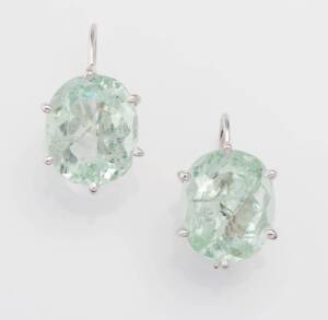 A pair of apatite earrings, claw set oval stones with hook attachments. 18ct white gold. Weight 7.40 grams. Length 2cm.