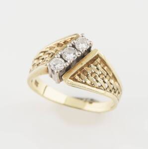 A three stone diamond ring, estimated total weight 0.45 carat. 14ct yellow gold. Weight 5.23 grams. Size N.