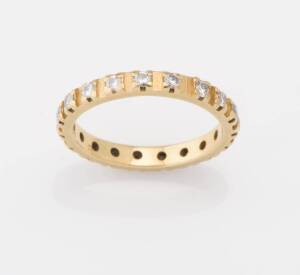 An all-around diamond eternity ring. 18ct yellow gold. Weight 2.91 grams. Size L ½.  