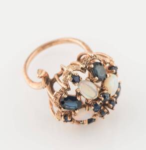 A white opal and sapphire ring, of floral cluster design. 9ct rose gold. Size L. Weight 7 grams.