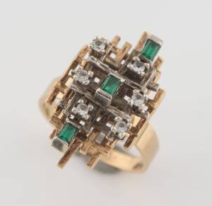 An emerald and diamond ring, of lattice design, circa 1960's. 9ct yellow and white gold. Weight 8 grams. Size O.