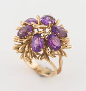 A multi-stone amethyst cocktail ring. 9ct yellow gold. Size O ½. Weight 12 grams.