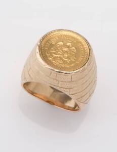 A gold coin signet ring, "Estados Unidos Mexicanos", Dos Y Medio, dated 1945. Yellow gold. Weight 32.95 grams. Size P ½ . (Mount testing as 12ct) 