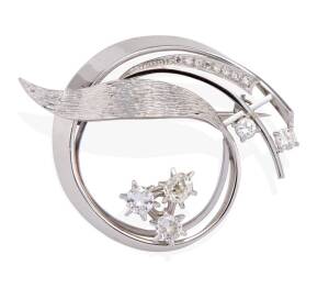 A diamond brooch, of circular scroll design, set with old and modern brilliant diamonds, estimated total weight 1 carat. 18ct white gold and platinum. Weight 13 grams. Diameter 4.5cm.