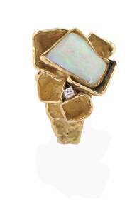A &nbsp;white opal and diamond ring, circa 1970's. 9ct yellow gold. Weight 20 grams. Size P.