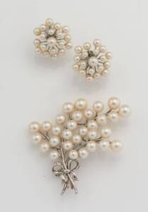 A pair of Akoya pearl earrings and a pearl spray brooch, Mikimoto. Silver. Length of brooch 6cm. Diameter of earrings 2.5cm. Earrings in original box.