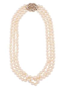 A cultured pearl necklace of triple strand design, 7.1 - 5.5mm, hung with a pierced 14ct yellow and white gold diamond set clasp. Length of shortest strand 46cm.
