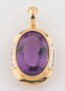 An amethyst and diamond pendant enhancer. 18ct yellow gold. Weight 12.39 grams. Length including bale 4.3cm. Length of amethyst 2.4cm.