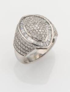 A diamond marquise cluster ring, pave set with round brilliant and tapered baguette diamonds. 9ct white gold. Weight 5.80 grams. Size K&nbsp;&frac12;.&nbsp;