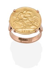 A 1936 half sovereign ring set in 9ct gold mount.