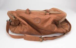 Two overnight bags, Columbian Bags Co. Soft distressed leather, tan, with a long adjustable strap and carry straps. The main compartment with a zip closure and a waterproof interior. The bags measure approximately 50x28x28cm, and 55x25x28cm.