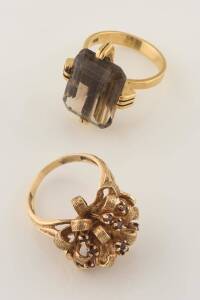 A smoky quartz cocktail ring. 18ct yellow gold. Weight &nbsp;12.78 grams. Size U. To be sold with a 14ct yellow gold garnet ring. Weight 12.58 grams. Size S &frac12;.