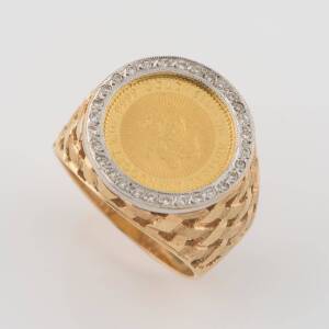 A diamond coin ring, the signet style ring set with a commemorative gold coin marked 1989 The Australian Nugget 1/10 ounce .9999; &nbsp;Elizabeth II, Australia $15" &nbsp;18ct yellow gold. Weight 14.12 grams. Size W.
