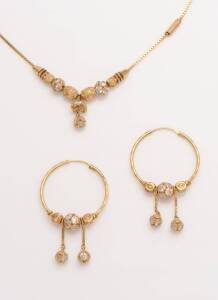 A white stone suite, comprising a pair of hoop earrings and a pendant necklace. 18ct yellow gold. Weight 13.74 grams. Length 21cm.