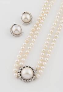 An Akoya pearl necklace, hung with a diamond and Mabe pearl clasp. 14ct white gold. To be sold with a pair of matching earrings. 14ct white gold. Total earring weight: 16.6 grams