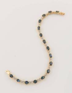 A sapphire and diamond bracelet, the oval blue sapphires horizontally set and spaced by two bezel set diamonds.18ct yellow gold. Weight 14 grams. Length 19.5cm.