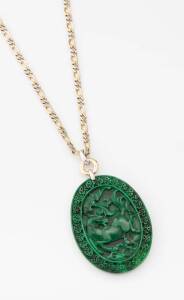 A carved greenstone pendant on gold chain. 18ct yellow and white gold. Weight of chain 65.23 grams. Length of chain 44cm. Length of pendant 8cm.&nbsp;