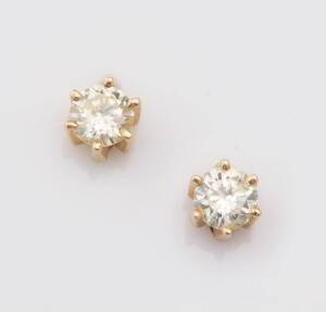 A pair of diamond studs, estimated total weight of round brilliant cut diamonds 0.60 carat. 18ct yellow gold. Weight 1.49 grams.