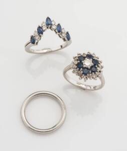 Three rings, one a plain band, one a fitted sapphire and diamond eternity ring and a sapphire and diamond cluster ring. 18ct white gold. Weight 21.85 grams. Size J - K.
