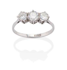 A three stone diamond ring, claw set with three transition cut diamonds of estimated total weight 1.00 carat. Platinum. Weight 3.72 grams.&nbsp;Size U.