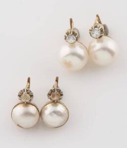 Two pairs of earrings, one set with button shaped cultured pearls and clear stones, the other with faux pearls and clear stones. Yellow gold. Weight 11.55 grams.