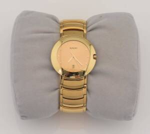 A Lady's Rado Diastar bracelet wristwatch, 2003. Quartz. Circular case, gold dial and date display. Gold plated. Original box, papers and extra links.&nbsp;