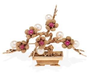 An unusual ruby and pearl Bonsai pendant brooch. 14ct rose gold. Weight 35 grams. Length 8cm.