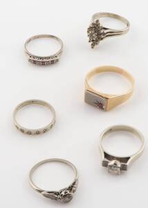 A collection of six various ruby and diamond rings, including a 0.60 carat solitaire diamond ring. 18ct white gold. Weight 15.66 grams. To be sold with a 9ct yellow gold signet ring. Weight 6.56 grams.&nbsp;