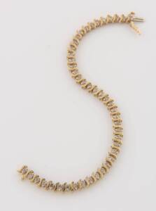 A diamond line bracelet, each of &nbsp;the 42 brilliant cut diamonds spaced by a yellow gold bar. Estimated total diamond weight 1.26 carats. 10ct yellow gold. Weight 9.79 grams. Length 17.5cm.