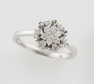 A diamond cluster ring, total diamond weight 0.30 carat. 18ct white gold. Weight 3.36 grams. Size M&nbsp;&frac12;.&nbsp;