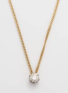 A diamond pendant on chain, the round brilliant cut diamond of estimated weight 1.22 carats. Yellow gold.&nbsp;