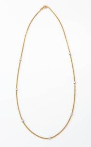 A diamond necklace, the curblink chain spaced by seven bezel set brilliant cut diamonds, estimated total diamond weight 0.90 carat. 18ct yellow gold.&nbsp;Weight 7.5 grams. Length 28cm.&nbsp;