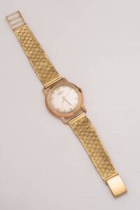 A Gentleman's wristwatch, Printania. Manual. 34mm. Circular 18ct rose gold case with silvered dial and applied gold Arabic numerals. Unsigned 17 jewel movement. Snap back. Detachable 18ct yellow gold mesh bracelet. Weight 65 grams. Length 19.5cm.