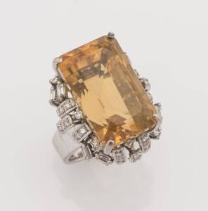 A citrine and diamond Cocktail ring. White metal. Weight 15.22 grams. Size M&frac12;.