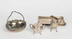 A circular basket, a cream jug, a sugar bowl & a tray, 29 x 23 cm
