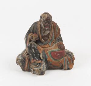 A Chinese Lohan figure, lacquer on clay, early 20th Century. 20cm high