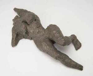 A plaster sculpture of a reclining nude