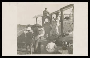 1935 (Feb) England-Australia Flight per Ray Parer & G Hemsworth Arrival at Darwin R Rohrer real photo Cards 1) the Plane in a Field (the Airport?); and 2) Five Men Inspecting the Plane while Ray Parer Effects Minor Repairs; unused. Ex rryan. [The plane wa