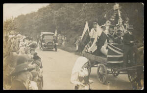 PATRIOTIC: Real photo Cards 1) World War I makeshift Float with Children & Flags of the Allies; and 2) World War II Proud Householder with his Amateurish Tribute to the Children's Fund; minor blemishes, unused. Ex Keith Harrison. (2)