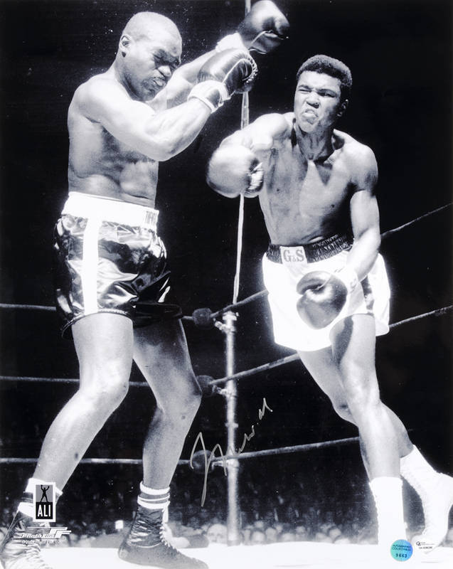 MUHAMMAD ALI, signed photograph from the Muhammad Ali vs Doug Jones fight, March 13th 1963, size 40x51cm. With 'Online Authentics' No.OA-8090285.