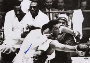 MUHAMMAD ALI, signed photograph from the Muhammad Ali vs Sonny Liston fight, February 25th 1964, size 51x36cm. With 'Online Authentics' No.OA-0000179.
