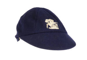 W.H.V. 'HOPPER' LEVETT'S ENGLAND&nbsp;TOURING TEST CAP, navy blue wool, embroidered St.George & Dragon on front, named inside "W.H.Levett". Few moth holes & lining worn,&nbsp;Fair/Good&nbsp;condition. ['Hopper' Levatt, Kent wicket-keeper 1930-47, played 1 Test in 1934].