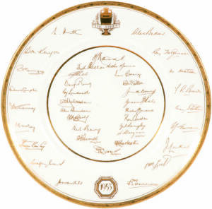 1953 ROYAL WORCESTER PLATE: "The Ashes. 1953", with facsimile signatures of both the Australian and England teams in gold. Together with 1980 Centenary Test tie & cricket books (2).