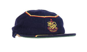 HONG KONG CRICKET CAP, blue with "HKCC" & Dragon logo embroidered on front, player unknown. G/VG condition.