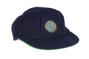 KAPIL DEV'S INDIAN TEST CAP, navy blue with wire embroidered Indian logo on front, signed inside by Kapil Dev and dated "2000". G/VG condition. [Kapil Dev played 131 Tests & 225 ODIs 1978-94, and captained the Indian cricket team which won the 1983 Cricke